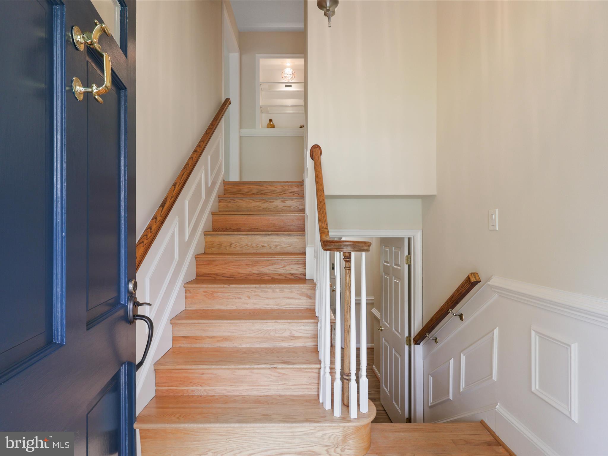 4417 Laurel Road Alexandria, VA 22309 - Photo 4 of 46 a view of staircase with white walls and a window