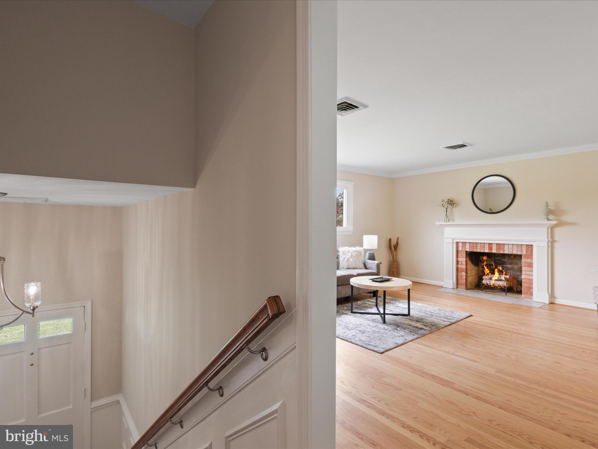 4417 Laurel Road Alexandria, VA 22309 - Photo 5 of 46 a living room with furniture and a fireplace