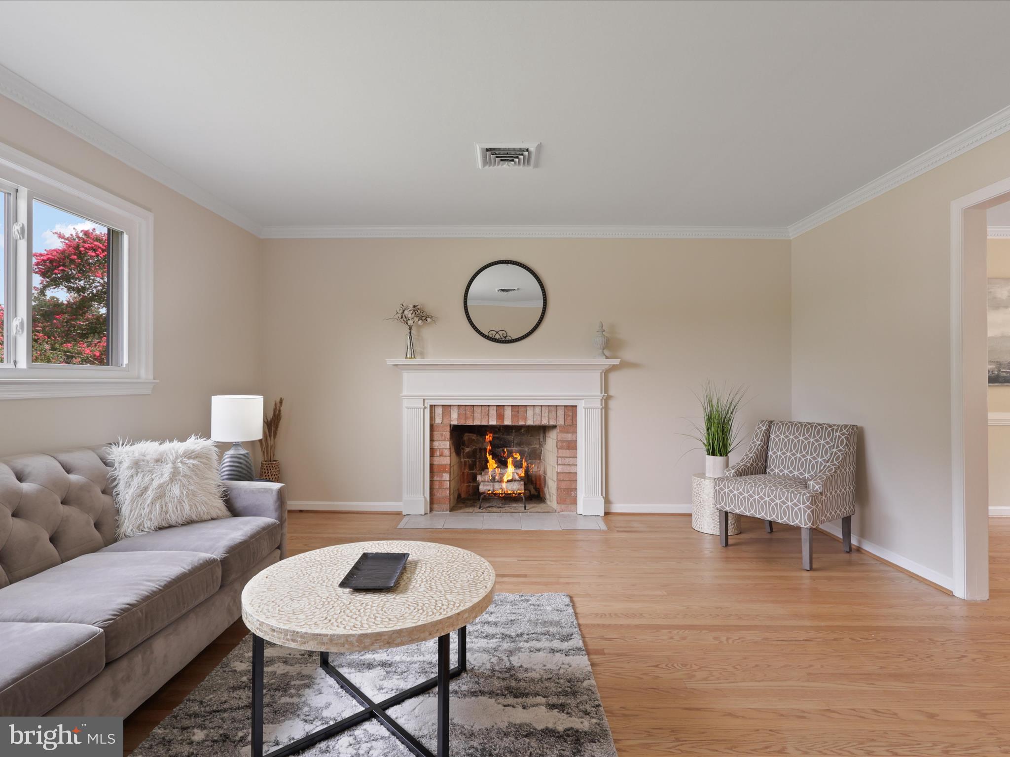 4417 Laurel Road Alexandria, VA 22309 - Photo 7 of 46 a living room with furniture and a fireplace