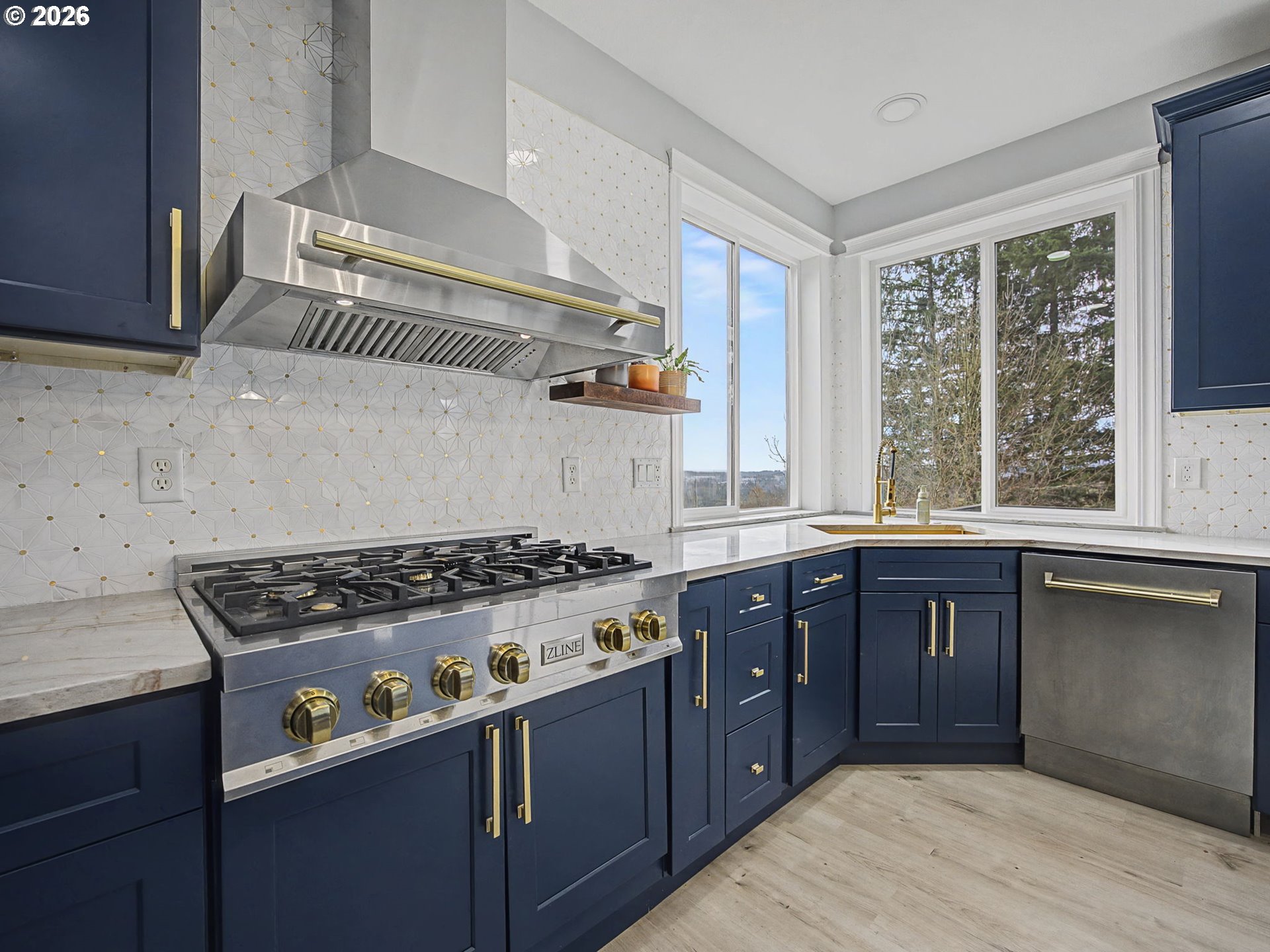 12410 Southwest Aspen Ridge Drive Tigard, OR 97224 - Photo 12 of 47 a kitchen with a stove a sink and a window