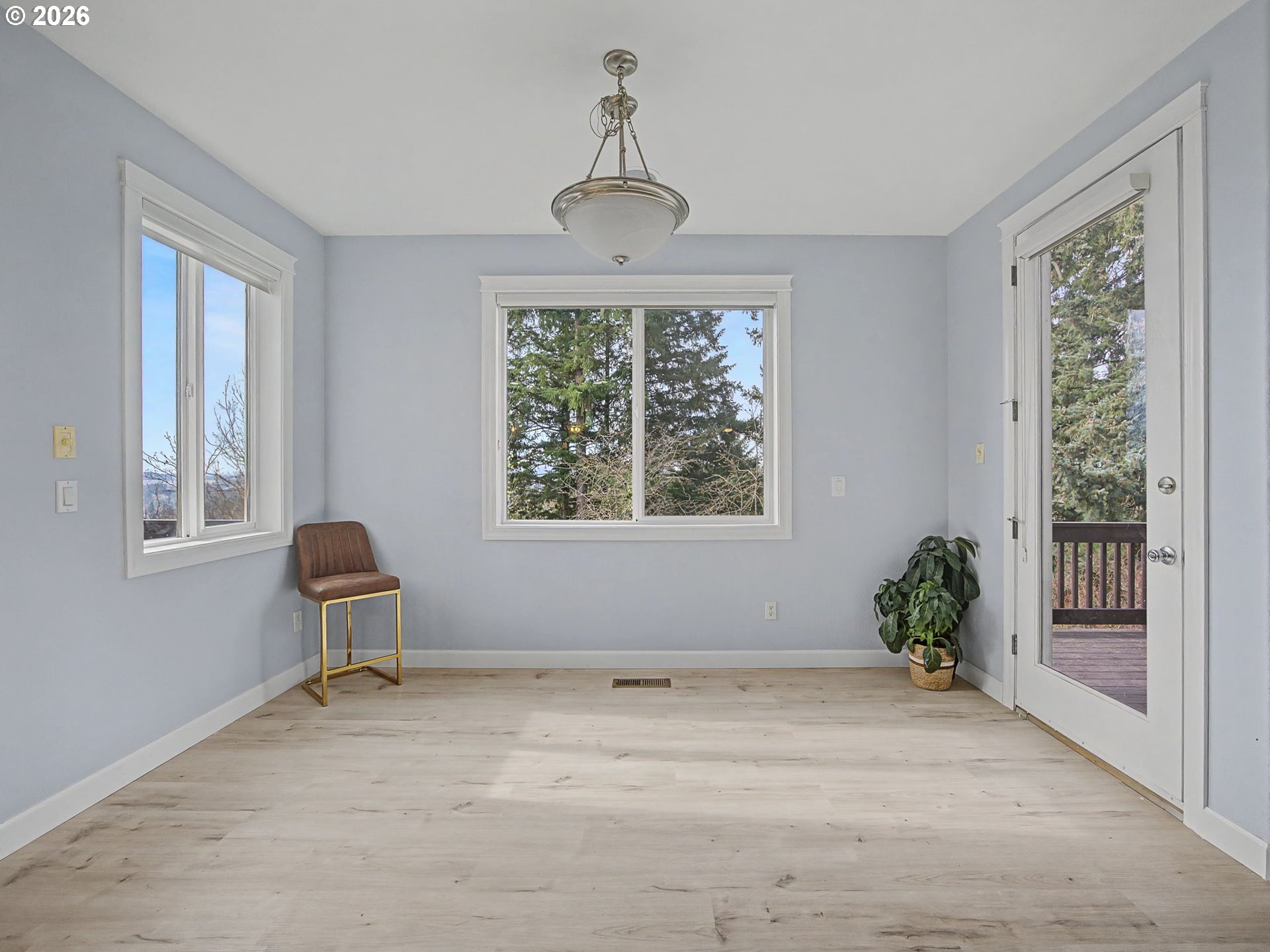 12410 Southwest Aspen Ridge Drive Tigard, OR 97224 - Photo 17 of 47 a view of a livingroom with a window and wooden floor