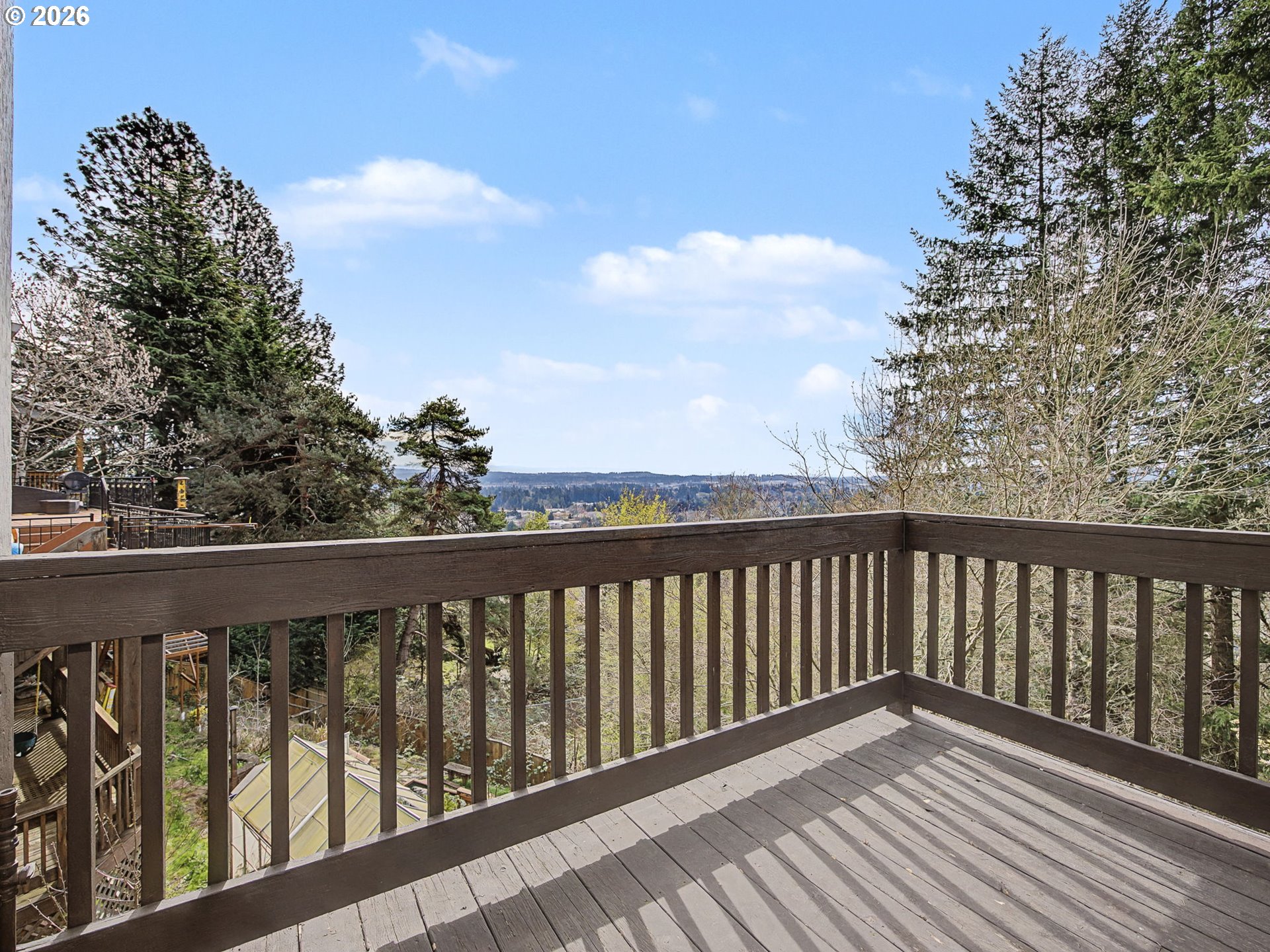 12410 Southwest Aspen Ridge Drive Tigard, OR 97224 - Photo 20 of 47 a balcony with wooden floor and fence