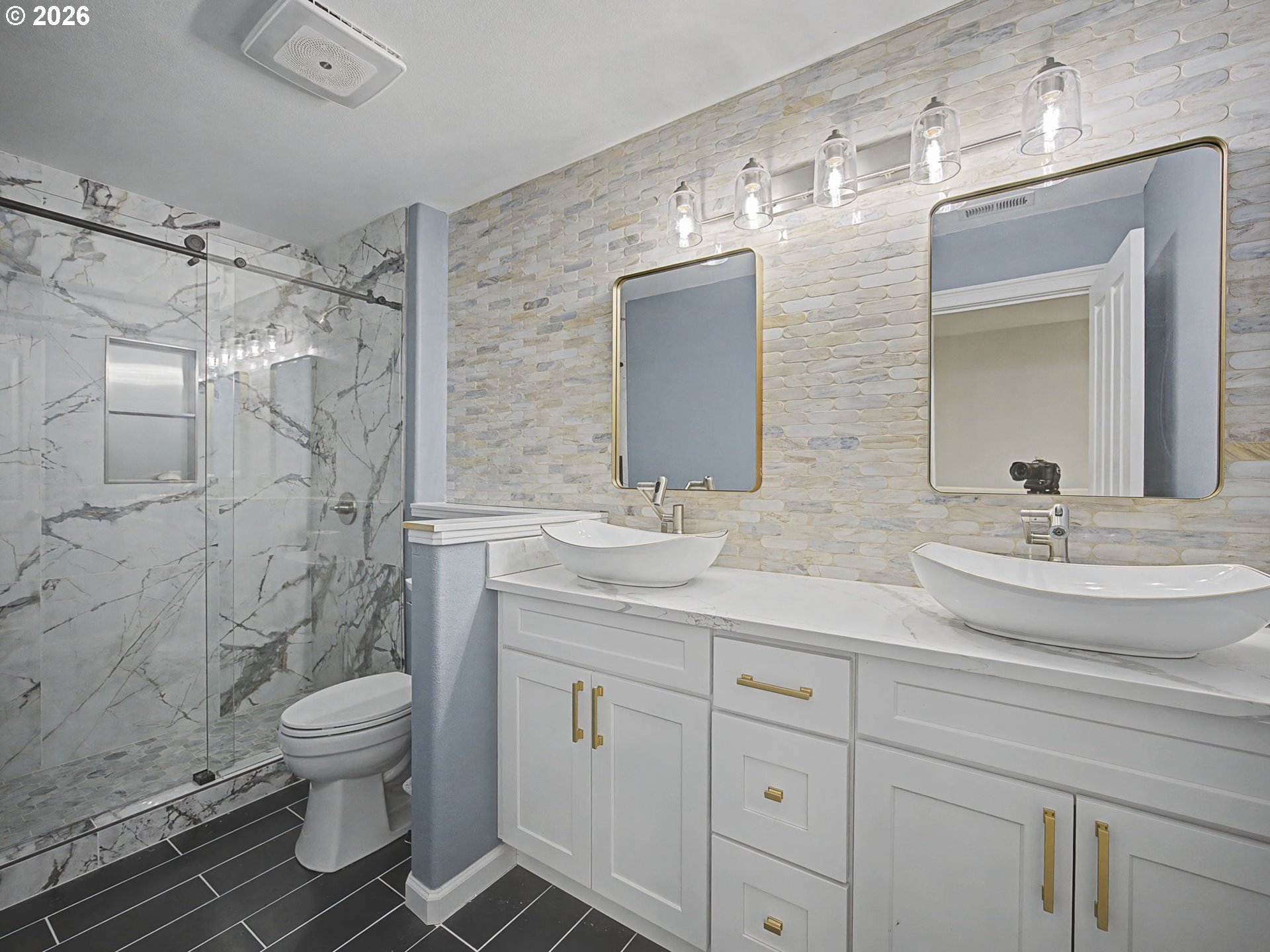 12410 Southwest Aspen Ridge Drive Tigard, OR 97224 - Photo 28 of 47 a bathroom with a double vanity sink toilet and shower