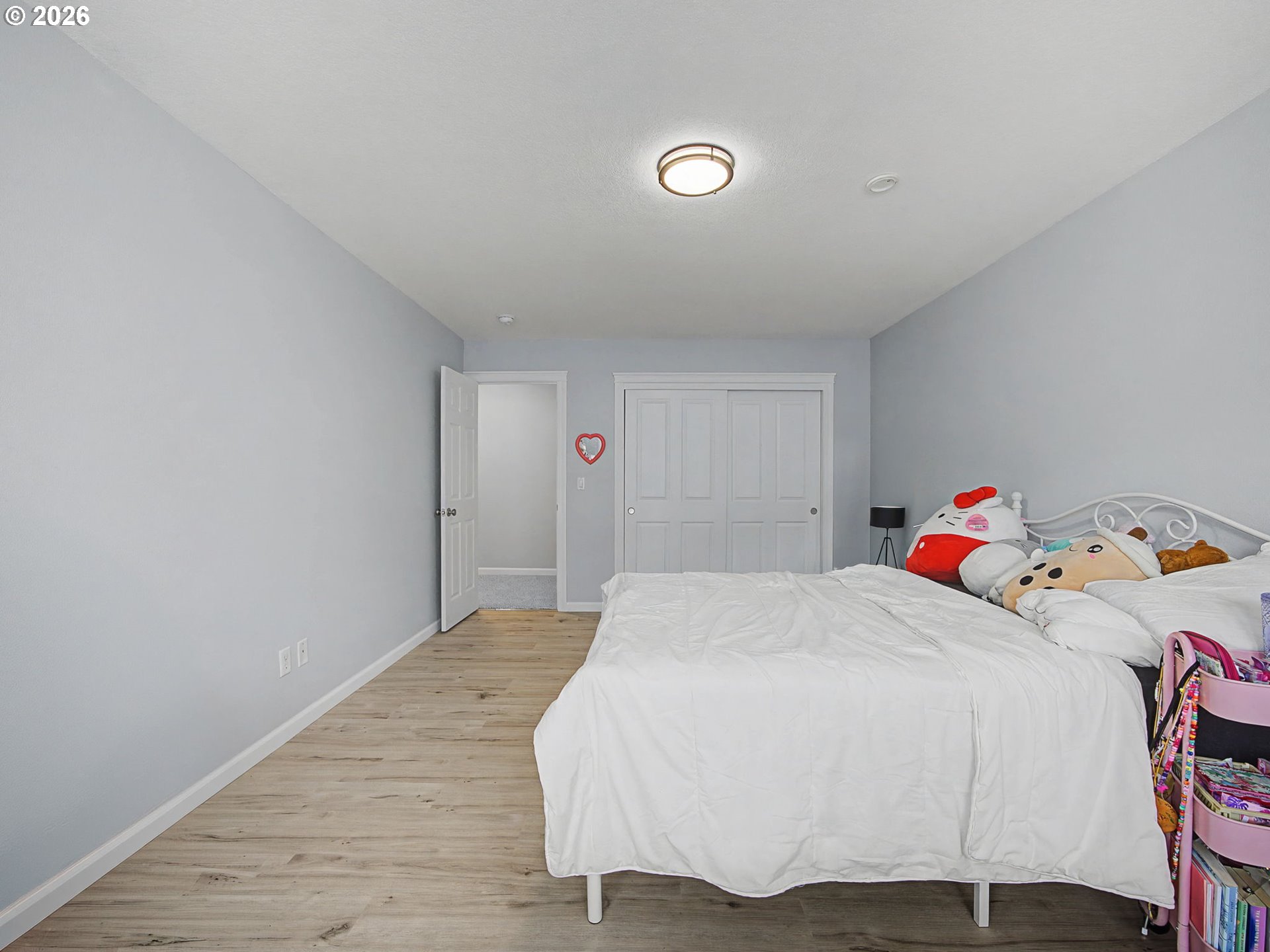 12410 Southwest Aspen Ridge Drive Tigard, OR 97224 - Photo 30 of 47 a bedroom with a bed and wooden floor
