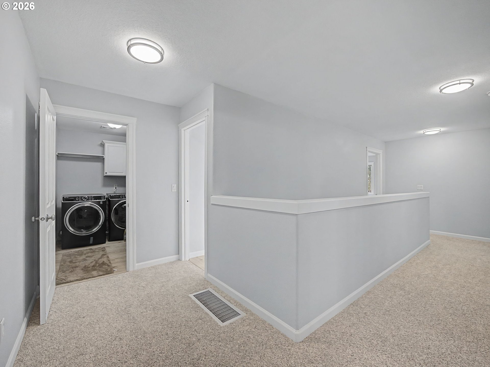 12410 Southwest Aspen Ridge Drive Tigard, OR 97224 - Photo 31 of 47 a view of a storage and utility room with washer and dryer