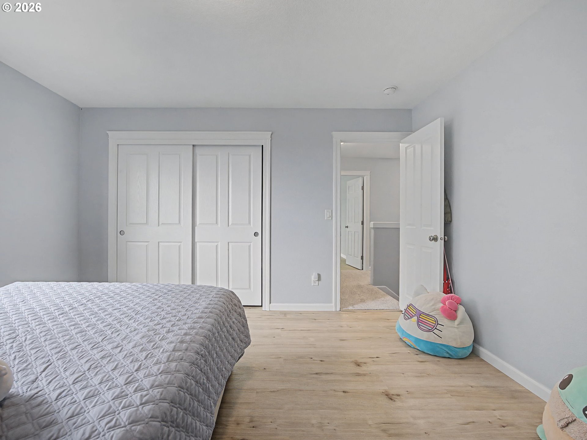 12410 Southwest Aspen Ridge Drive Tigard, OR 97224 - Photo 33 of 47 a bedroom with a bed and a window