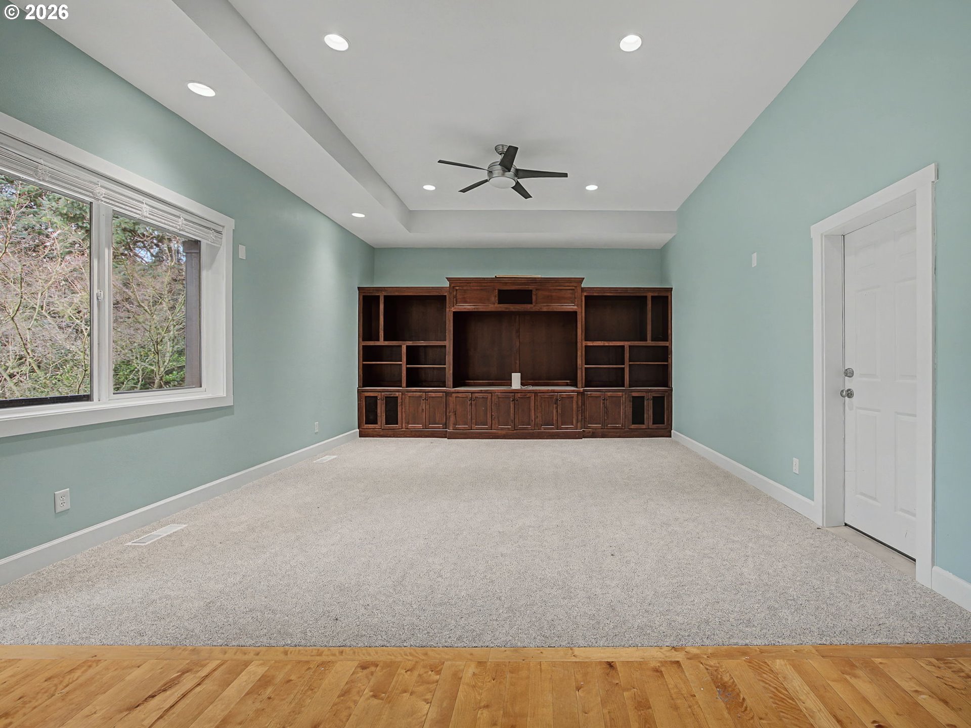 12410 Southwest Aspen Ridge Drive Tigard, OR 97224 - Photo 36 of 47 a view of an empty room with a window and a kitchen