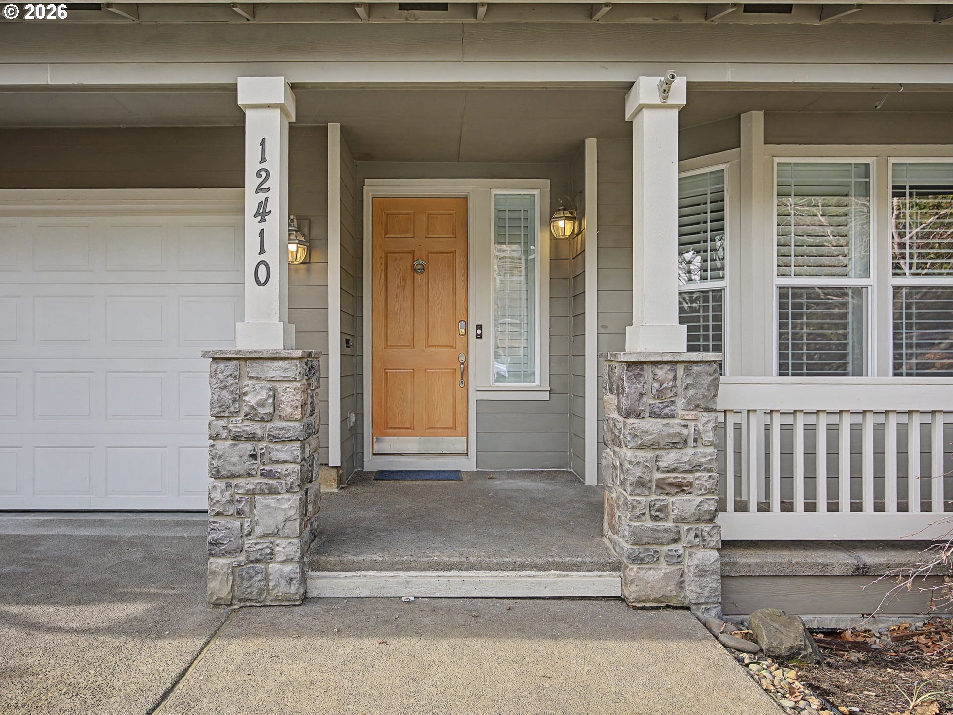 12410 Southwest Aspen Ridge Drive Tigard, OR 97224 - Photo 4 of 47 a front view of a house with a window