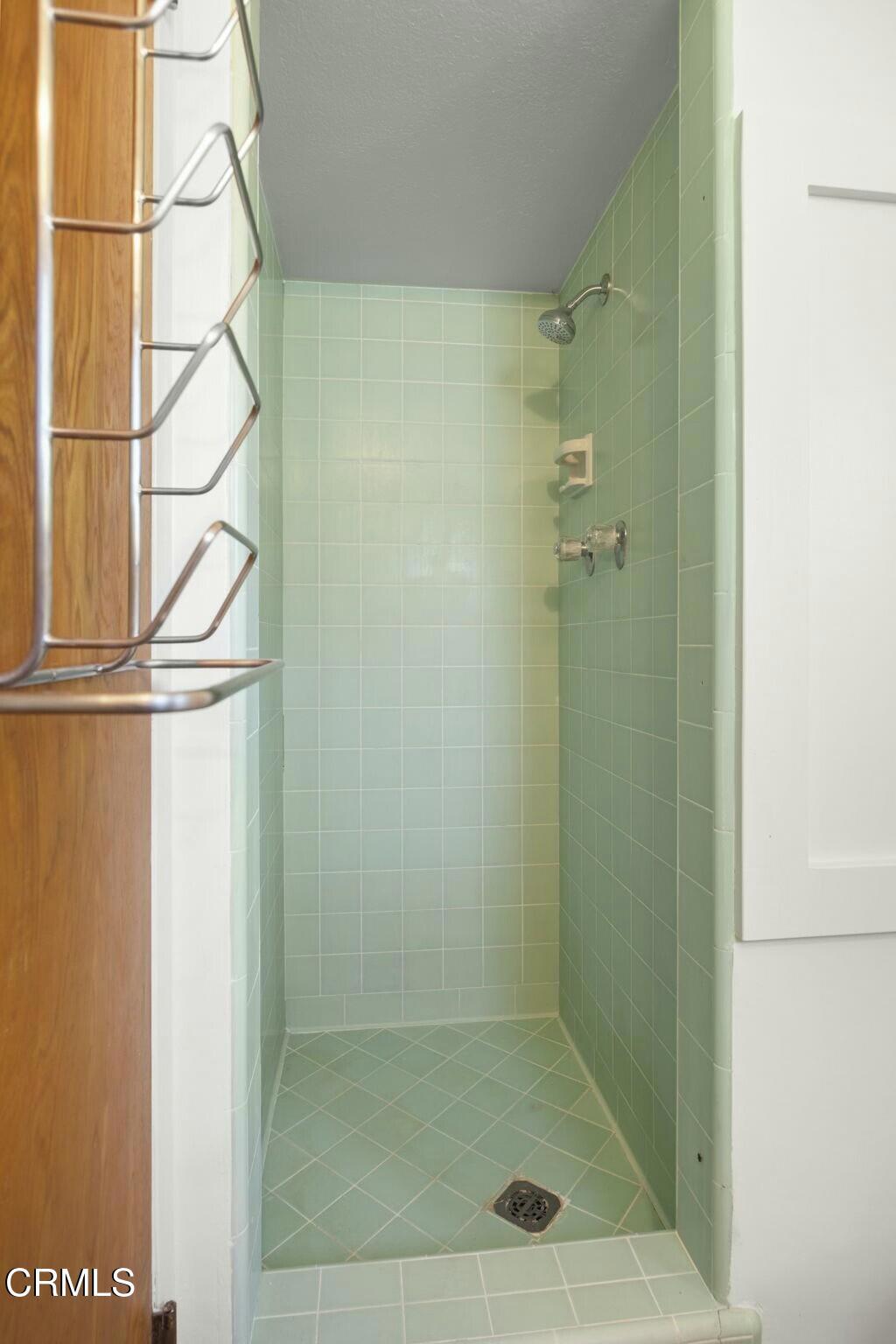 6861 Bristol Road Ventura, CA 93003 - Photo 36 of 42 a bathroom with a glass shower door