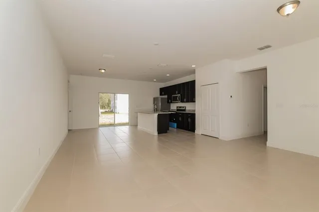 a view of a kitchen with a sink and dishwasher cabinets