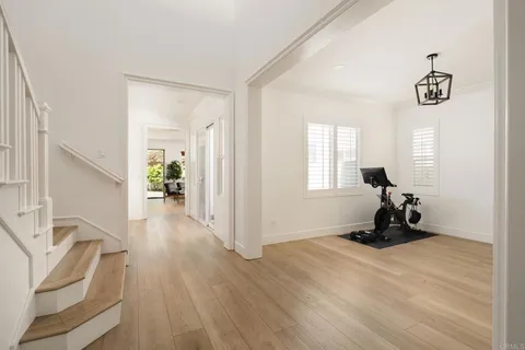 a view of a room with gym equipment and a window