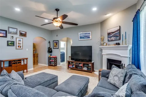 a living room with furniture and a flat screen tv