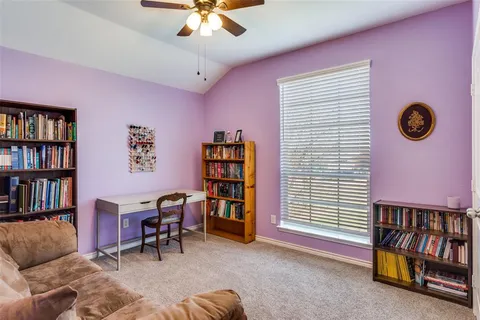 a view of a livingroom with workspace and a couch