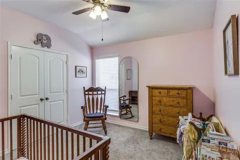a view of a livingroom with furniture and windows