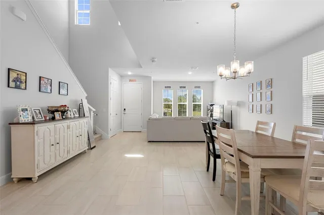a view of a dining room with furniture and window