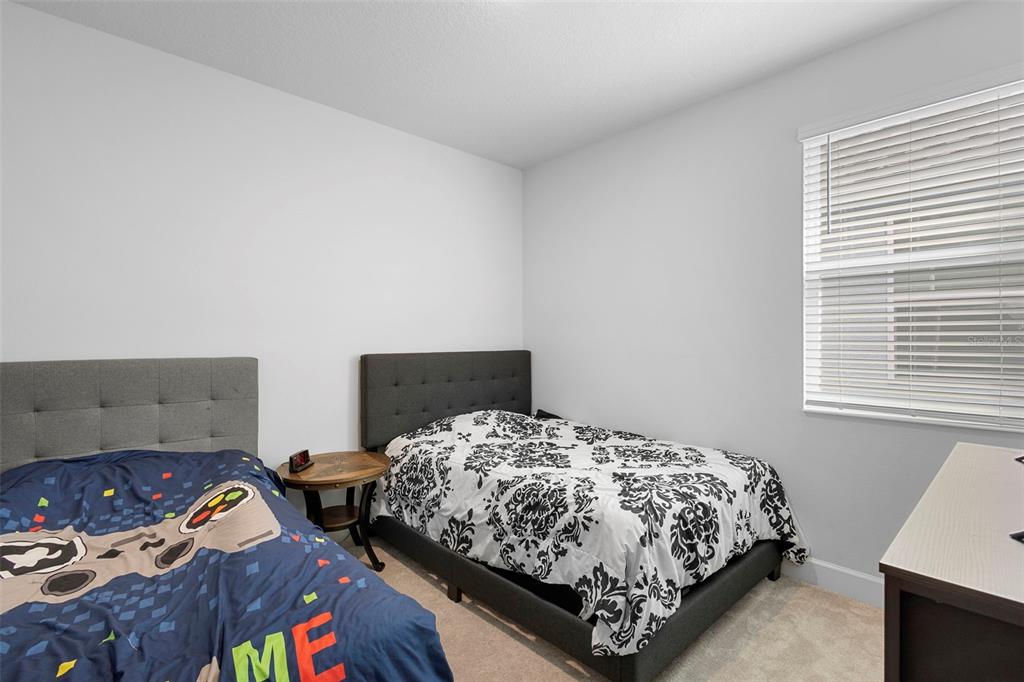 269 Platform Lane DeBary, FL 32713 - Photo 25 of 41 a bedroom with a bed and a dresser in it