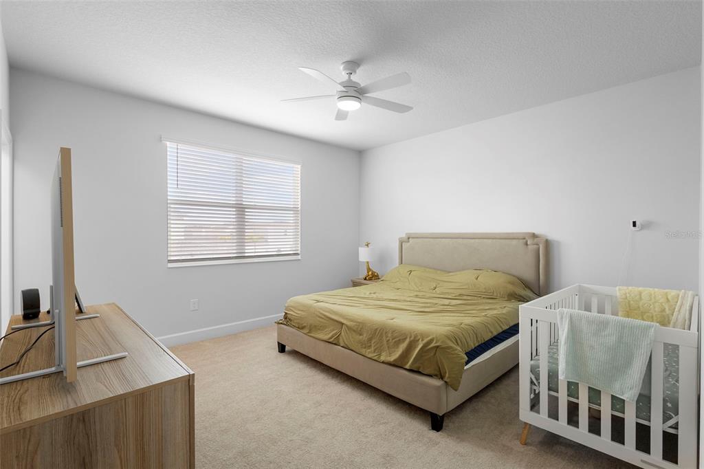 269 Platform Lane DeBary, FL 32713 - Photo 27 of 41 a bedroom with a bed and a table in it