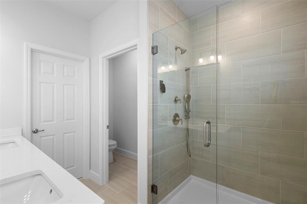 269 Platform Lane DeBary, FL 32713 - Photo 30 of 41 a bathroom with a shower and a toilet