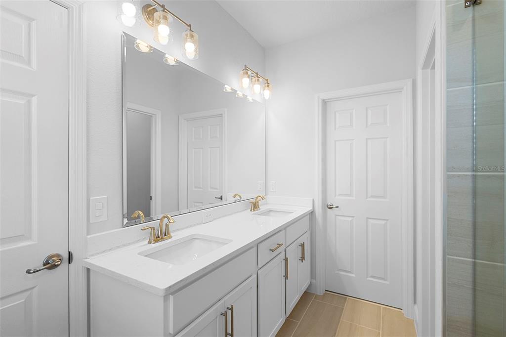 269 Platform Lane DeBary, FL 32713 - Photo 31 of 41 a bathroom with a sink vanity granite and a mirror