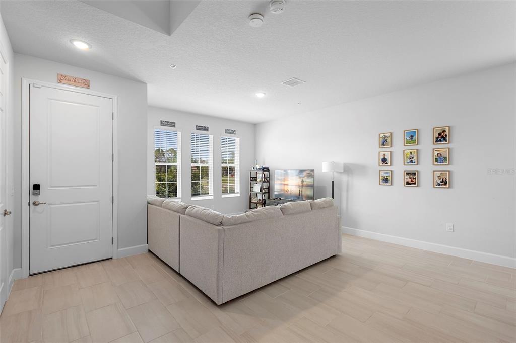 269 Platform Lane DeBary, FL 32713 - Photo 39 of 41 a living room with furniture and a large window
