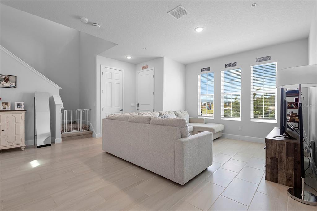 269 Platform Lane DeBary, FL 32713 - Photo 41 of 41 a living room with furniture a flat screen tv and a large window