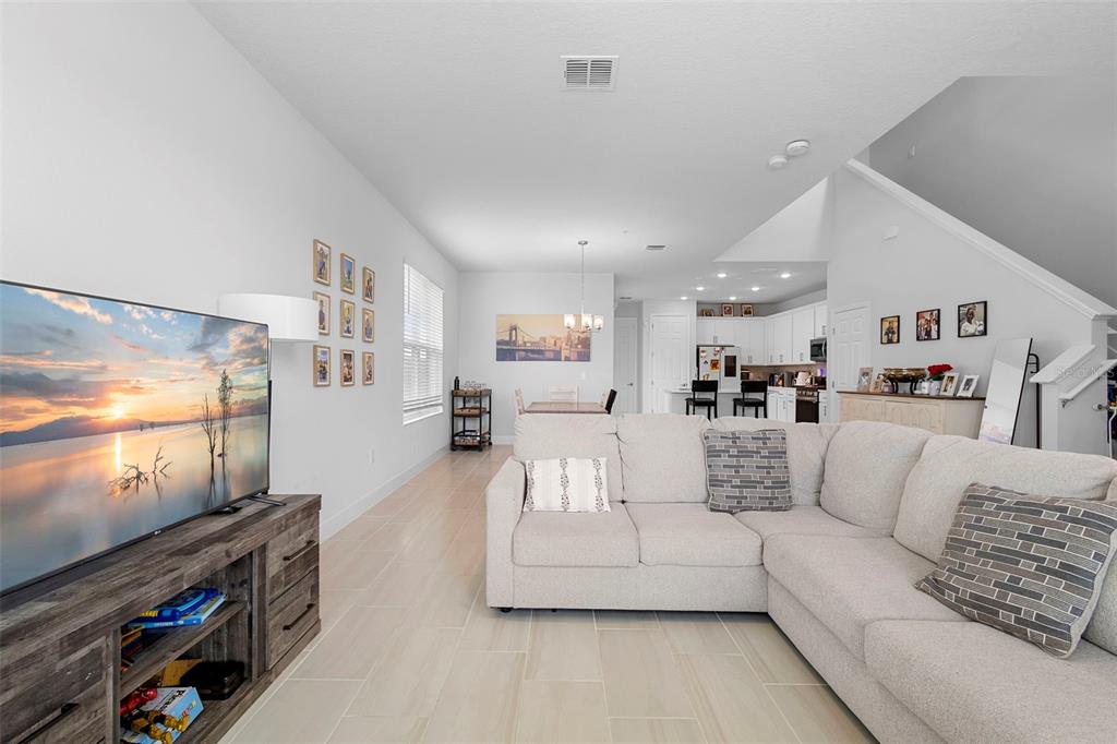 269 Platform Lane DeBary, FL 32713 - Photo 9 of 41 a living room with furniture and a flat screen tv