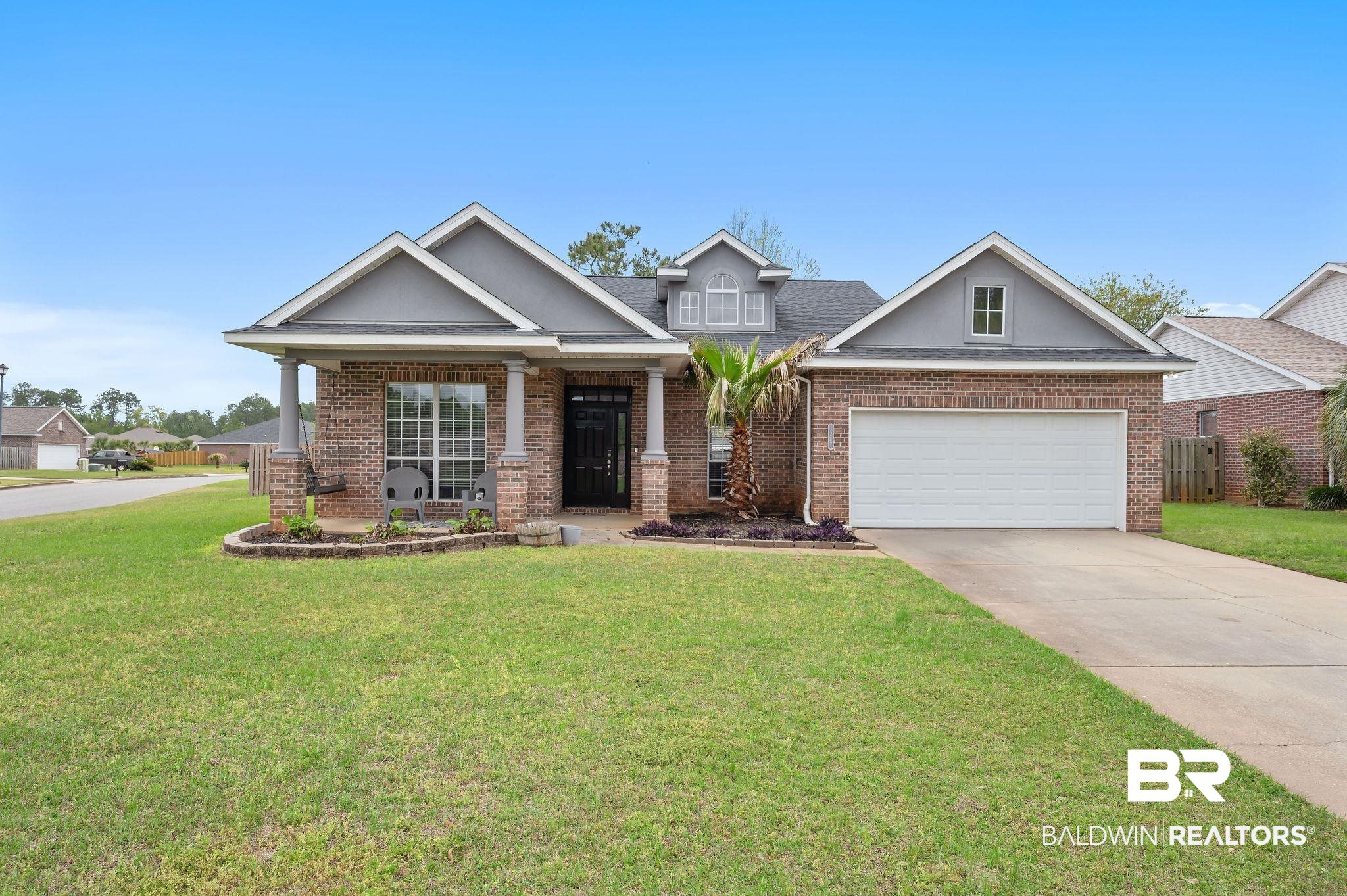 1287 Pembroke Way Foley, AL 36535 - Photo 1 of 39 Craftsman-style home with brick siding, concrete driveway, a porch, and a garage
