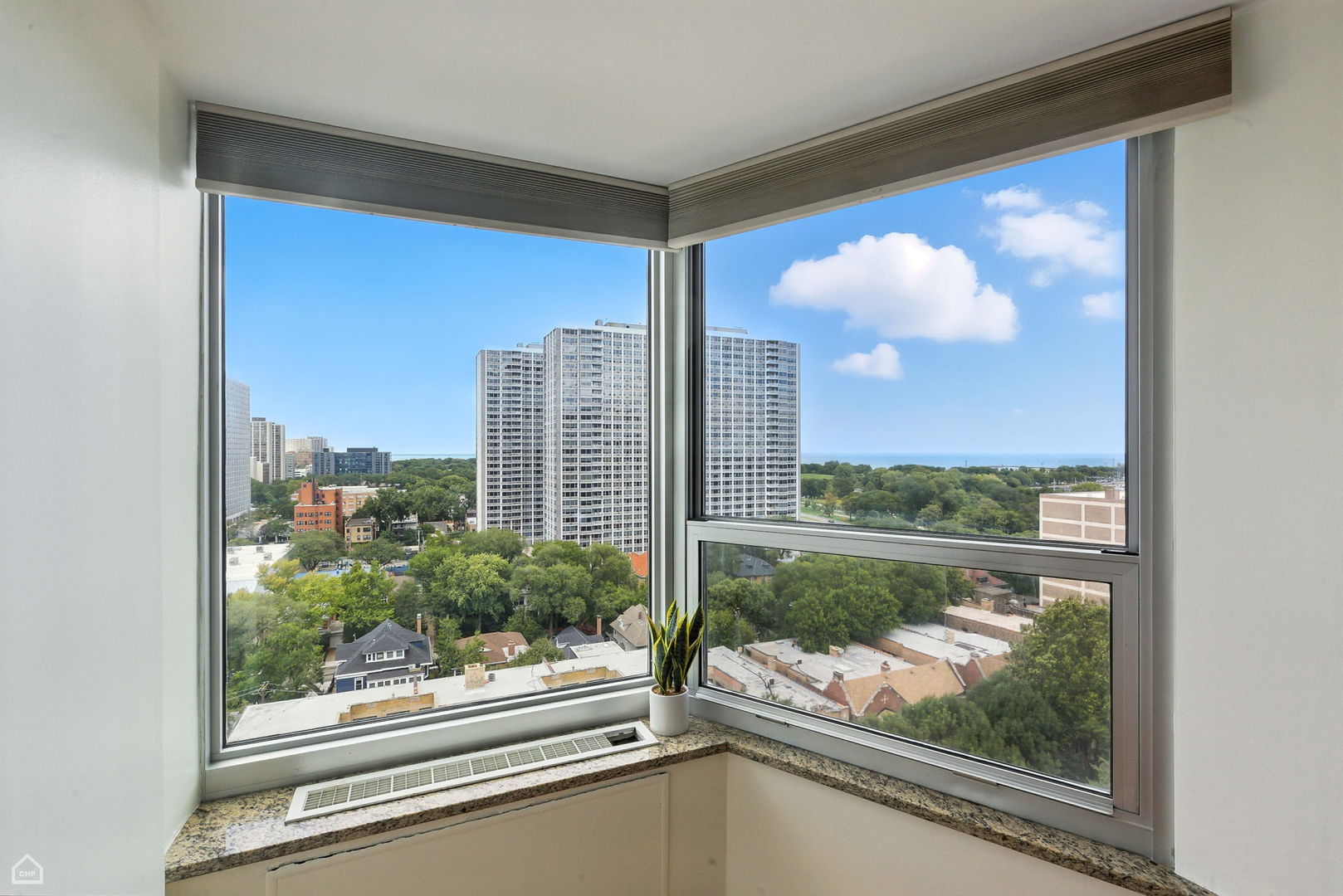 720 West Gordon Terrace, Unit 16E Chicago, IL 60613 - Photo 19 of 34 a view of a glass door and a living room