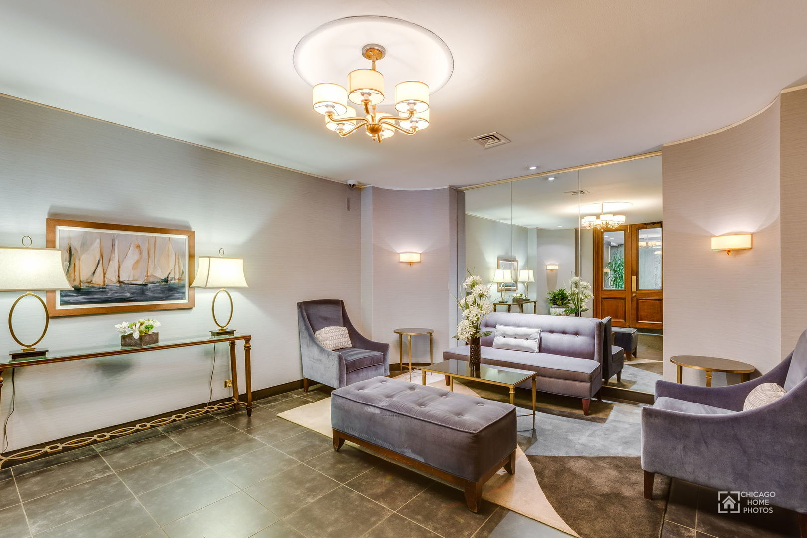 720 West Gordon Terrace, Unit 16E Chicago, IL 60613 - Photo 3 of 34 a living room with furniture and a chandelier