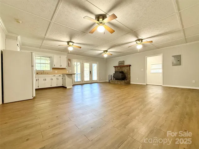 a view of a kitchen with a stove and a refrigerator