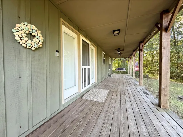 a view of balcony with wooden floor