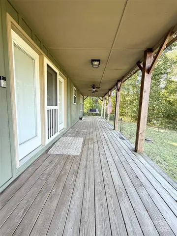 a view of outdoor space with wooden floor