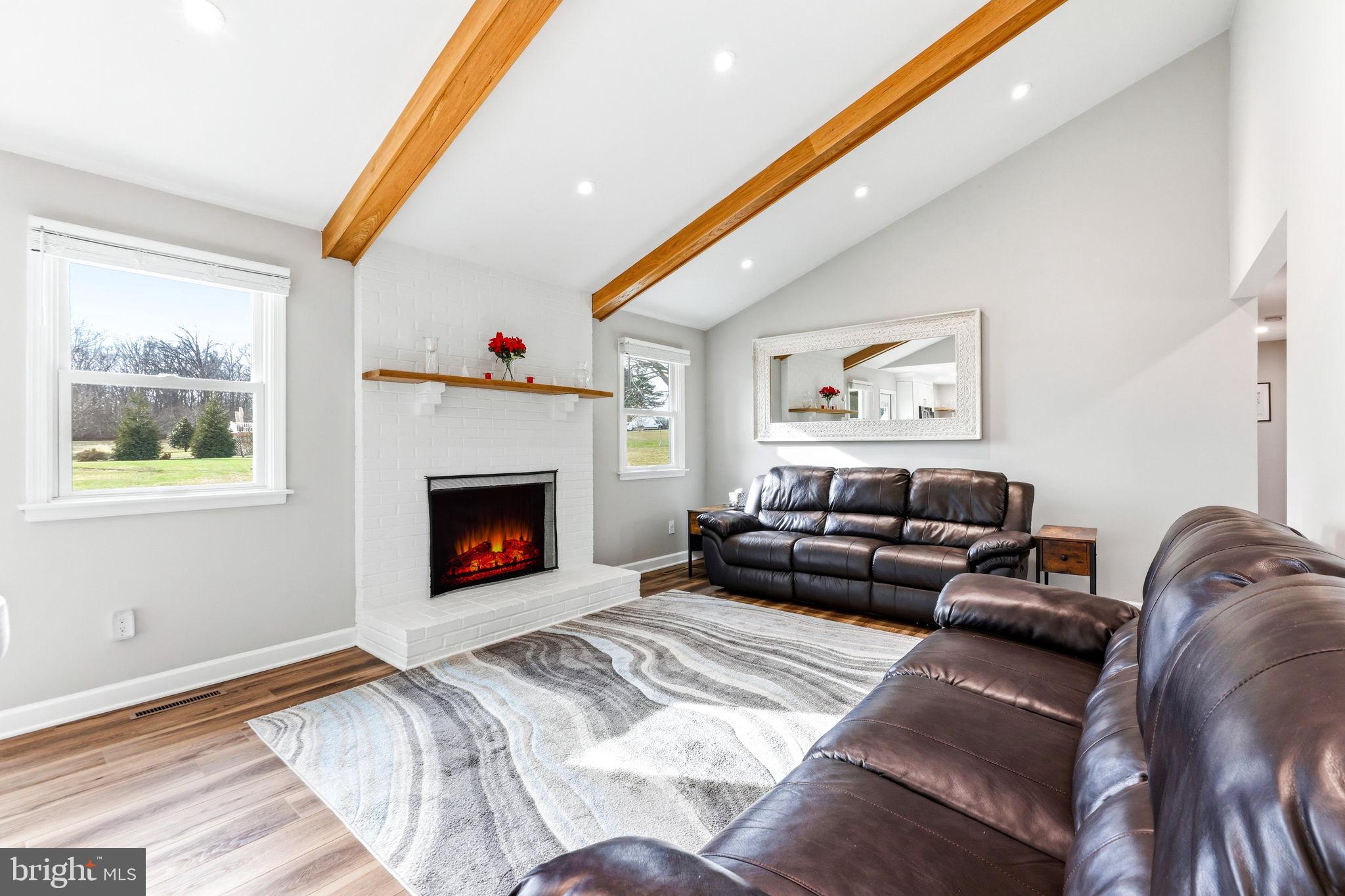 16932 Flickerwood Road Parkton, MD 21120 - Photo 13 of 64 a living room with furniture and a fireplace
