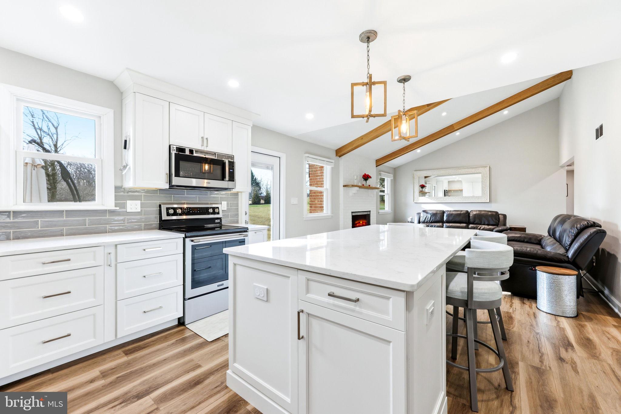 16932 Flickerwood Road Parkton, MD 21120 - Photo 15 of 64 a kitchen with kitchen island granite countertop a sink appliances cabinets and furniture