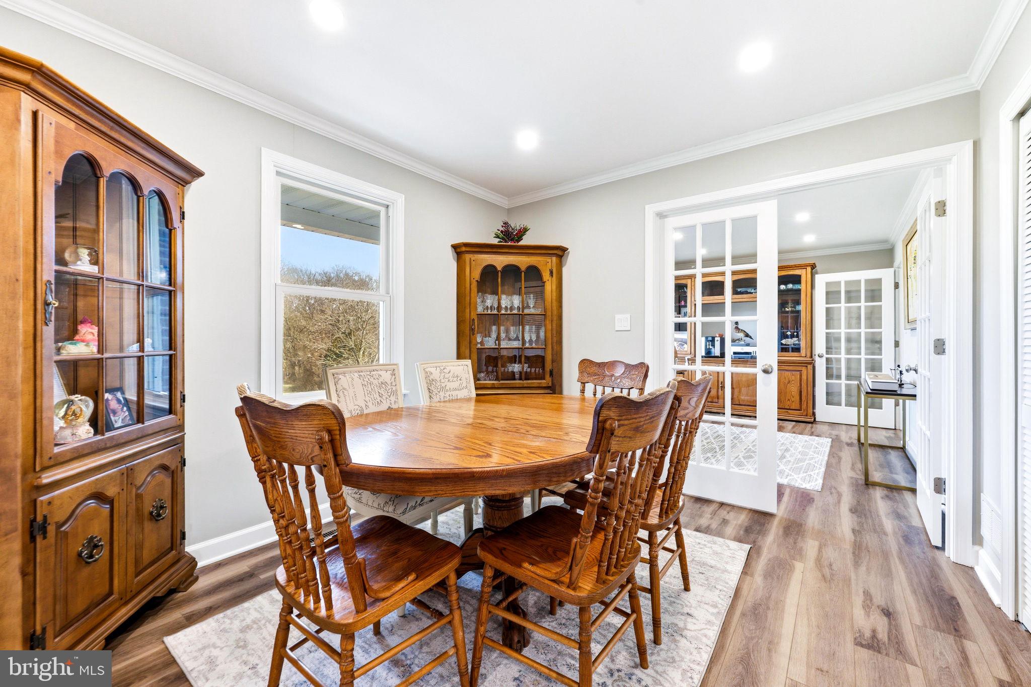 16932 Flickerwood Road Parkton, MD 21120 - Photo 19 of 64 a view of a dining room with furniture window and wooden floor