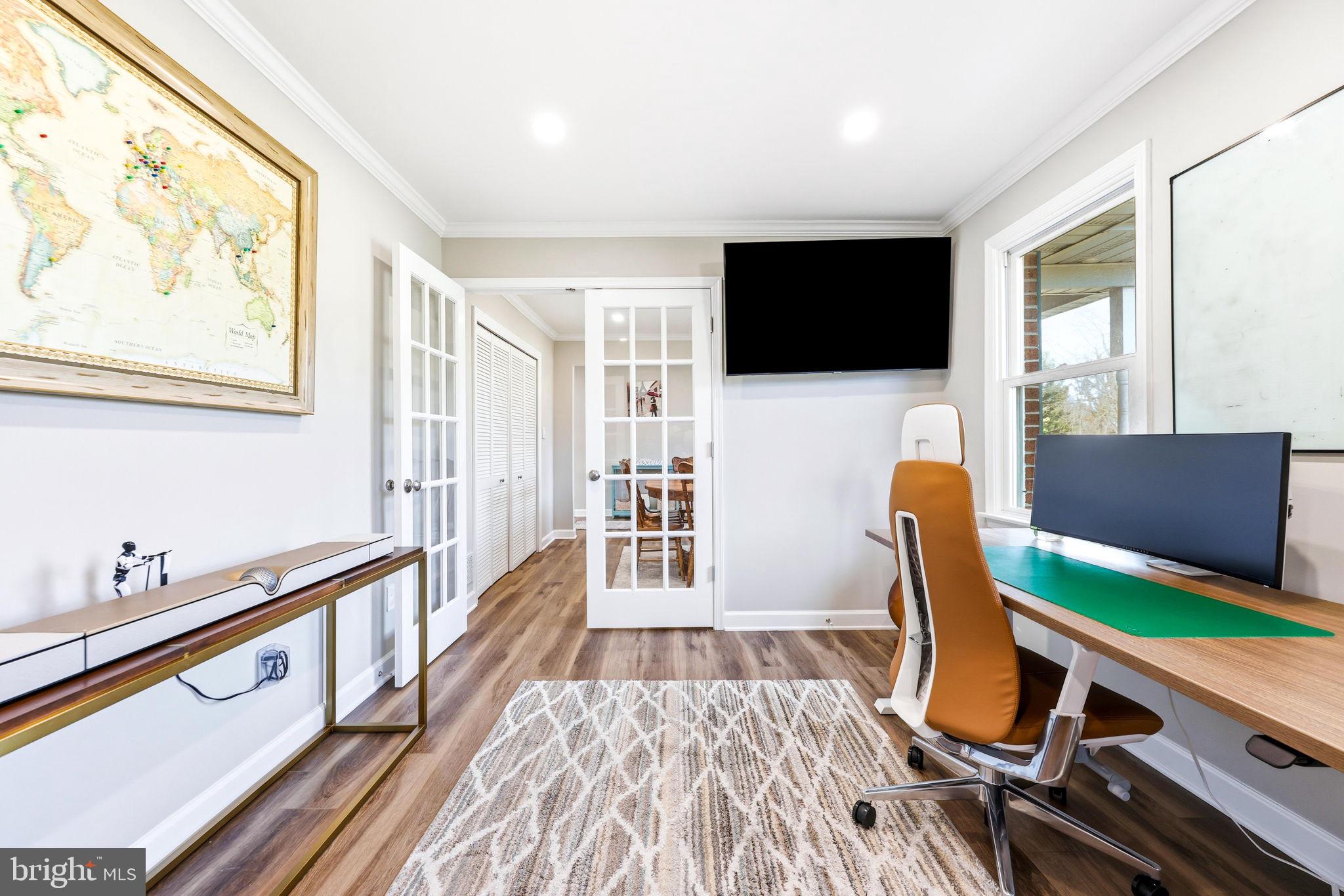 16932 Flickerwood Road Parkton, MD 21120 - Photo 22 of 64 a bedroom with furniture and a flat screen tv