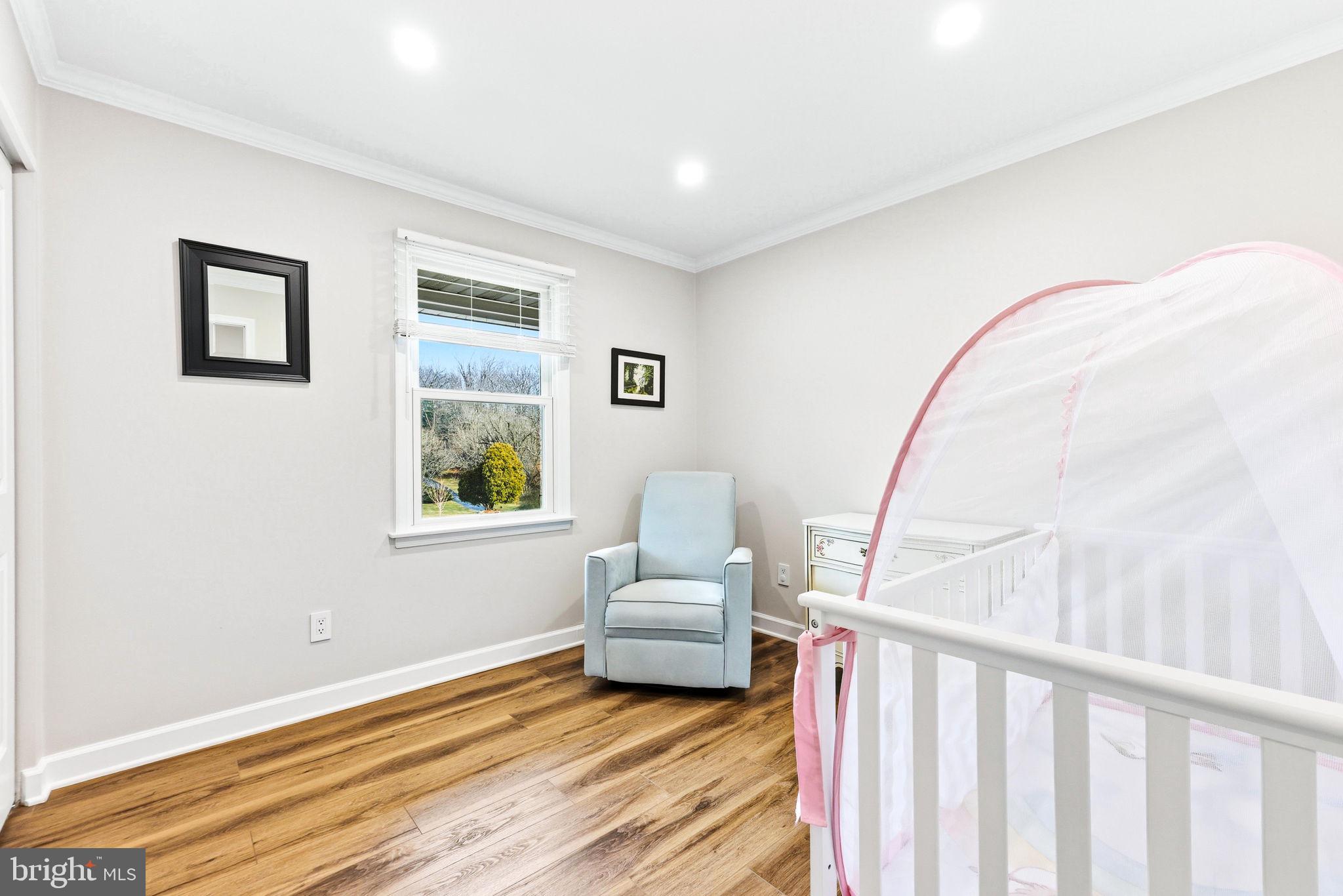 16932 Flickerwood Road Parkton, MD 21120 - Photo 23 of 64 a bedroom with a bed and a large window