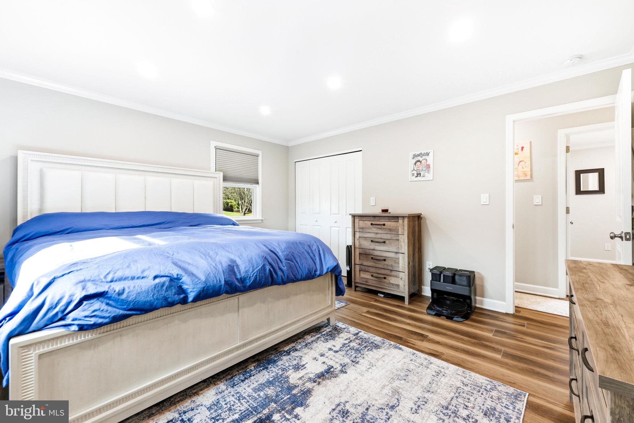 16932 Flickerwood Road Parkton, MD 21120 - Photo 31 of 64 a bedroom with a bed and wooden floor