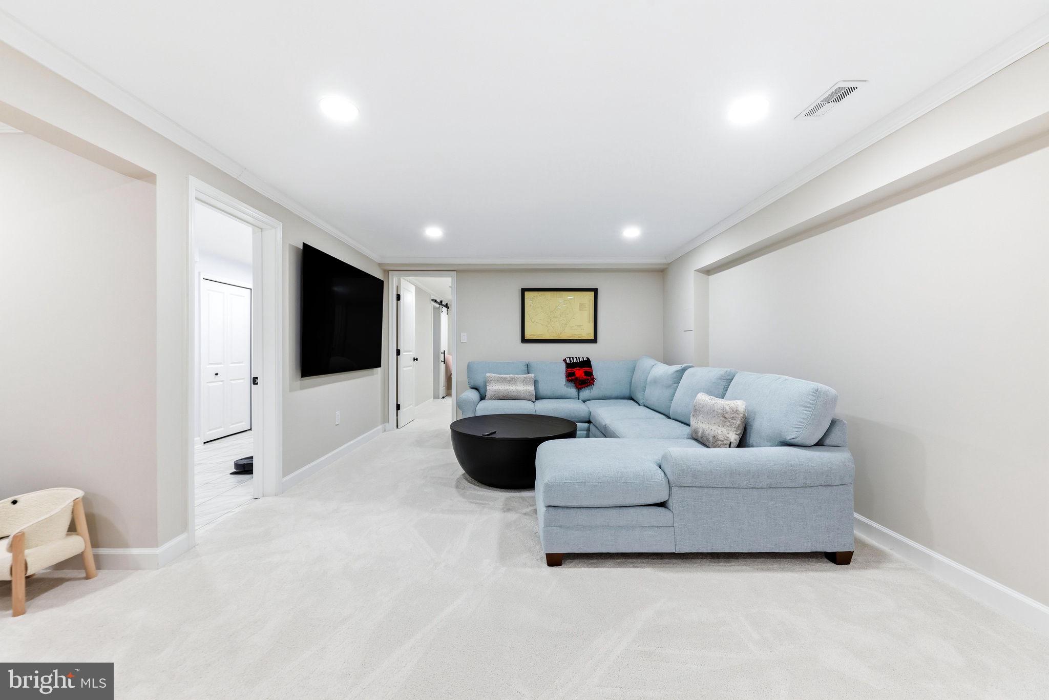 16932 Flickerwood Road Parkton, MD 21120 - Photo 34 of 64 a living room with furniture and a flat screen tv