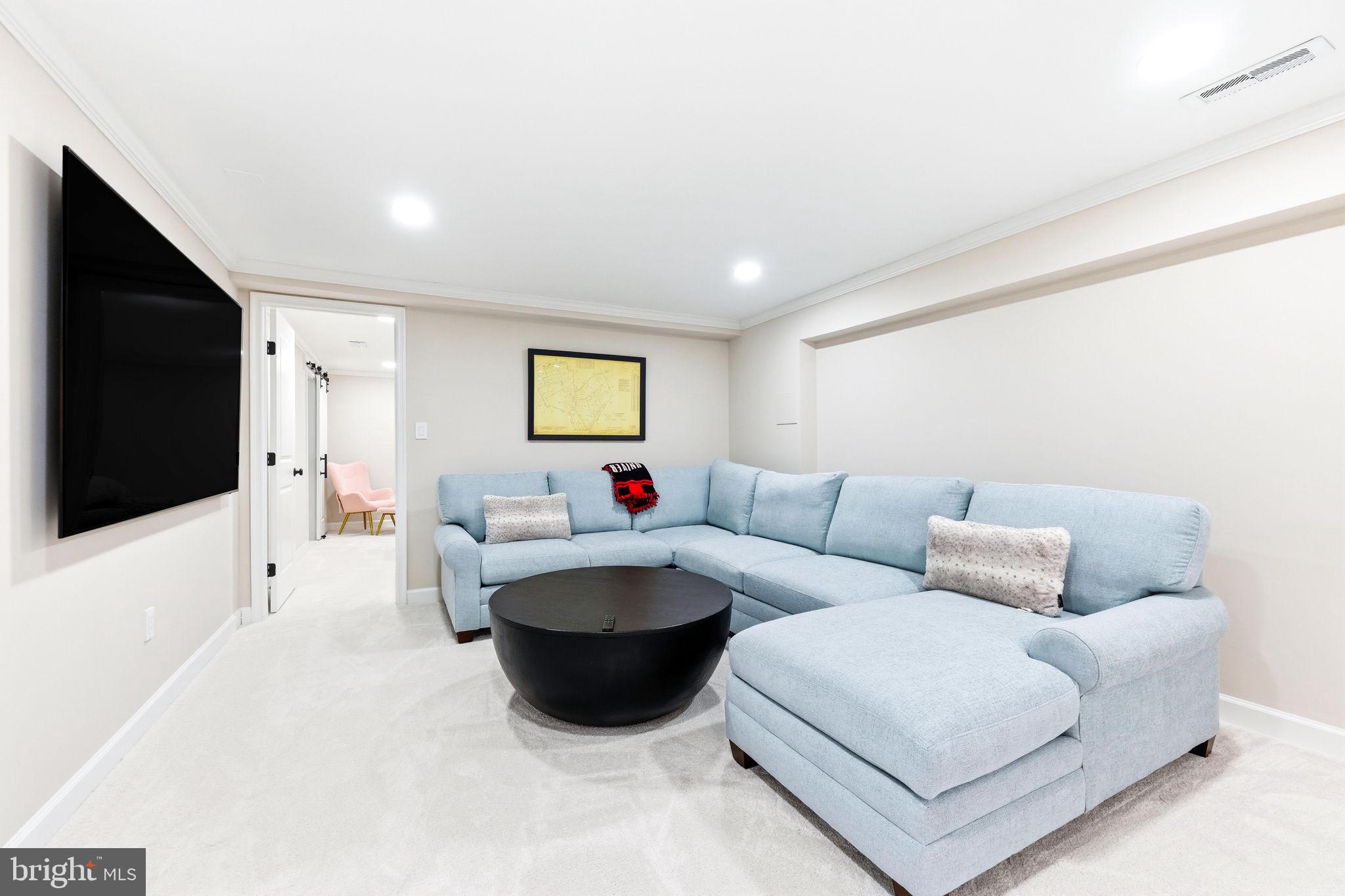 16932 Flickerwood Road Parkton, MD 21120 - Photo 35 of 64 a living room with furniture and a flat screen tv