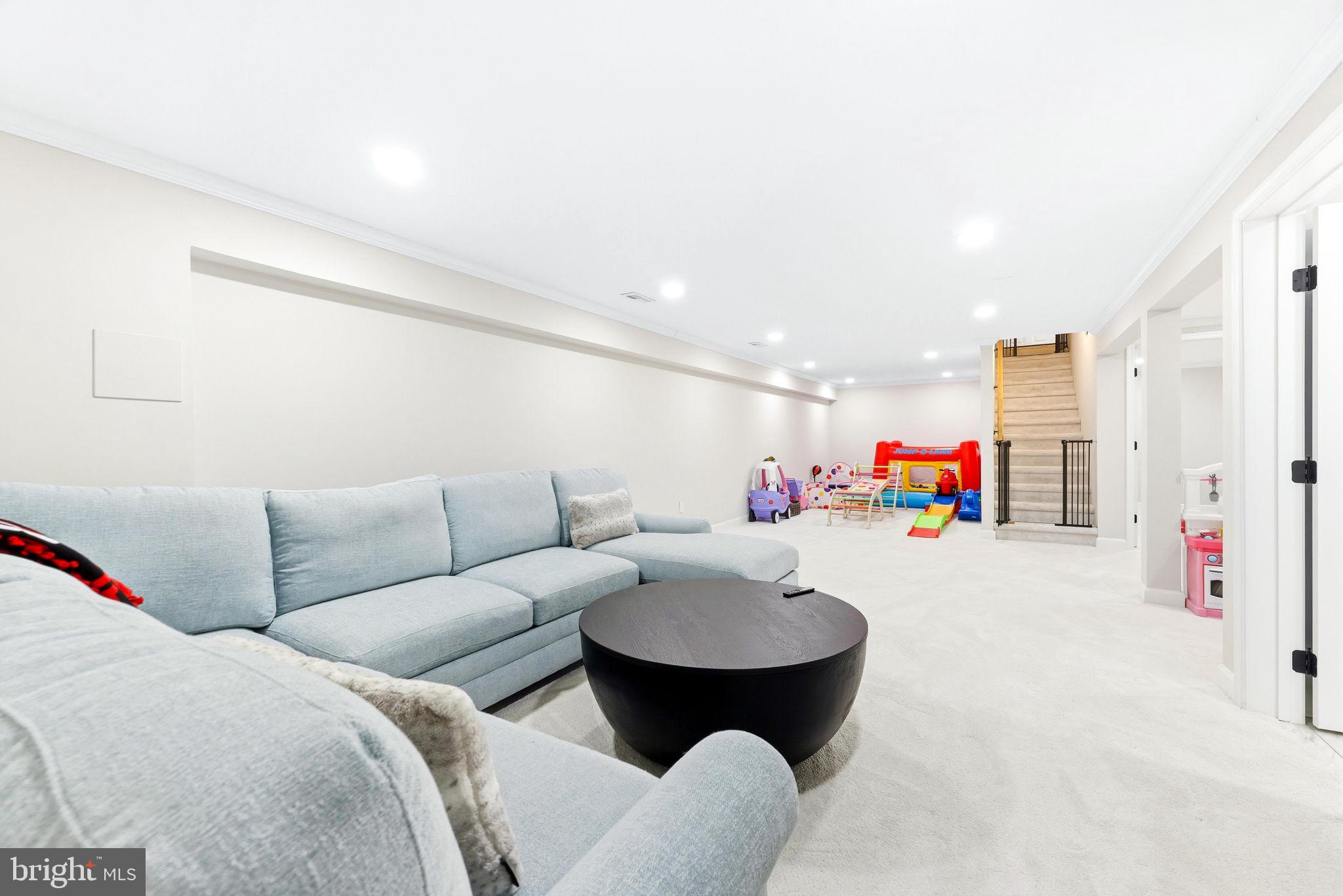 16932 Flickerwood Road Parkton, MD 21120 - Photo 36 of 64 a living room with furniture and a flat screen tv
