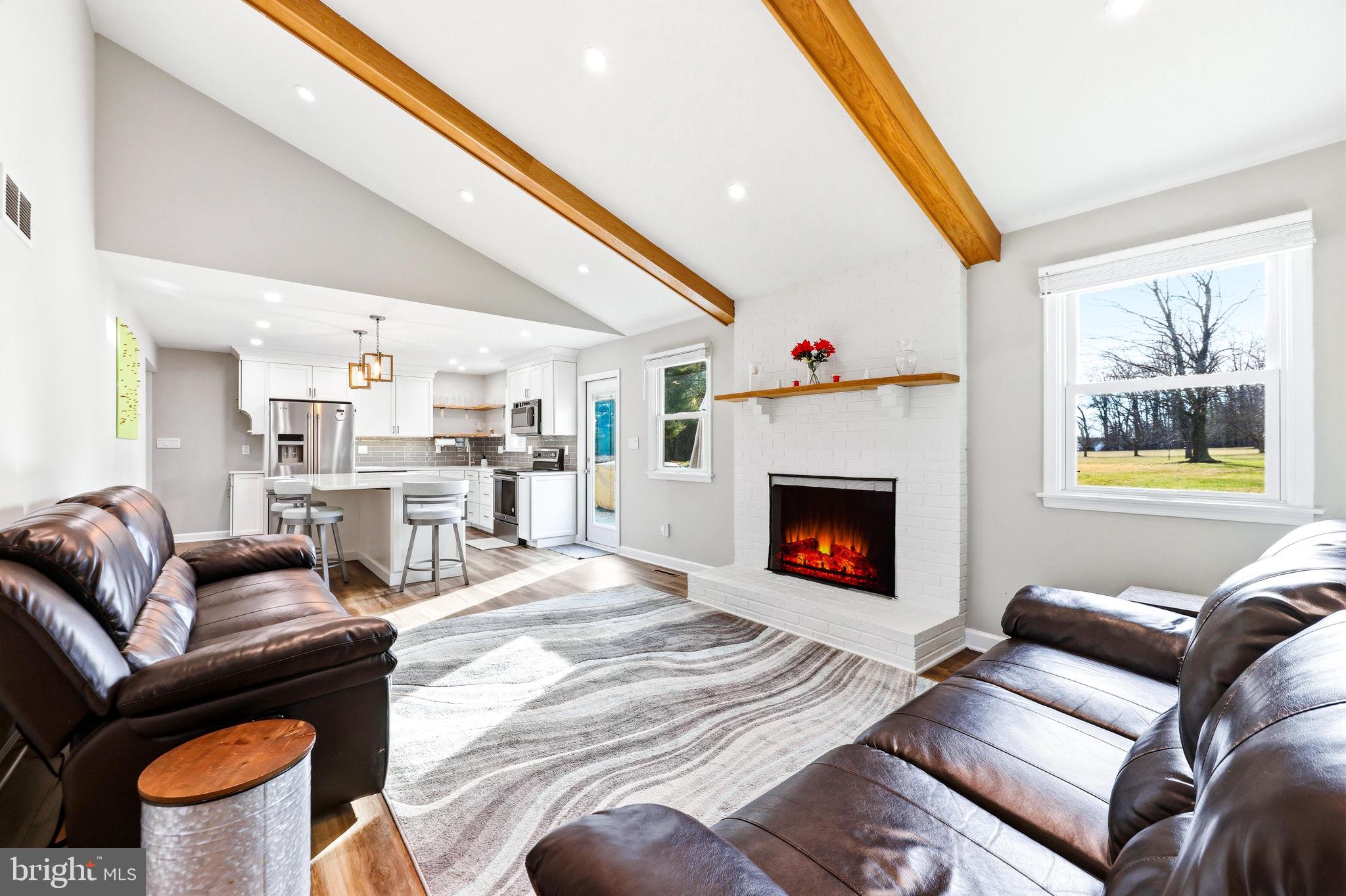 16932 Flickerwood Road Parkton, MD 21120 - Photo 4 of 64 a living room with furniture and a fireplace