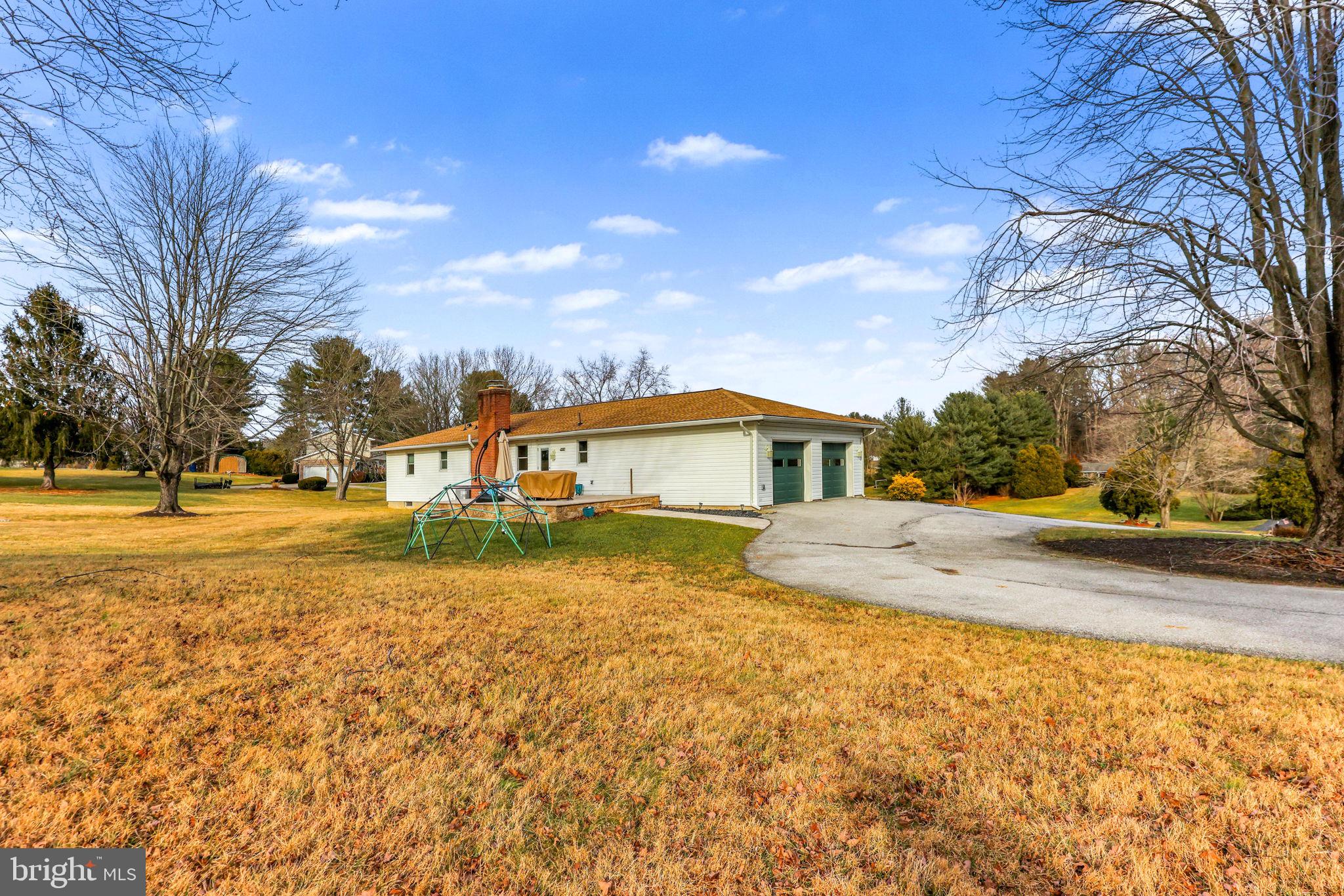 16932 Flickerwood Road Parkton, MD 21120 - Photo 51 of 64 a view of house with yard and trees in the background