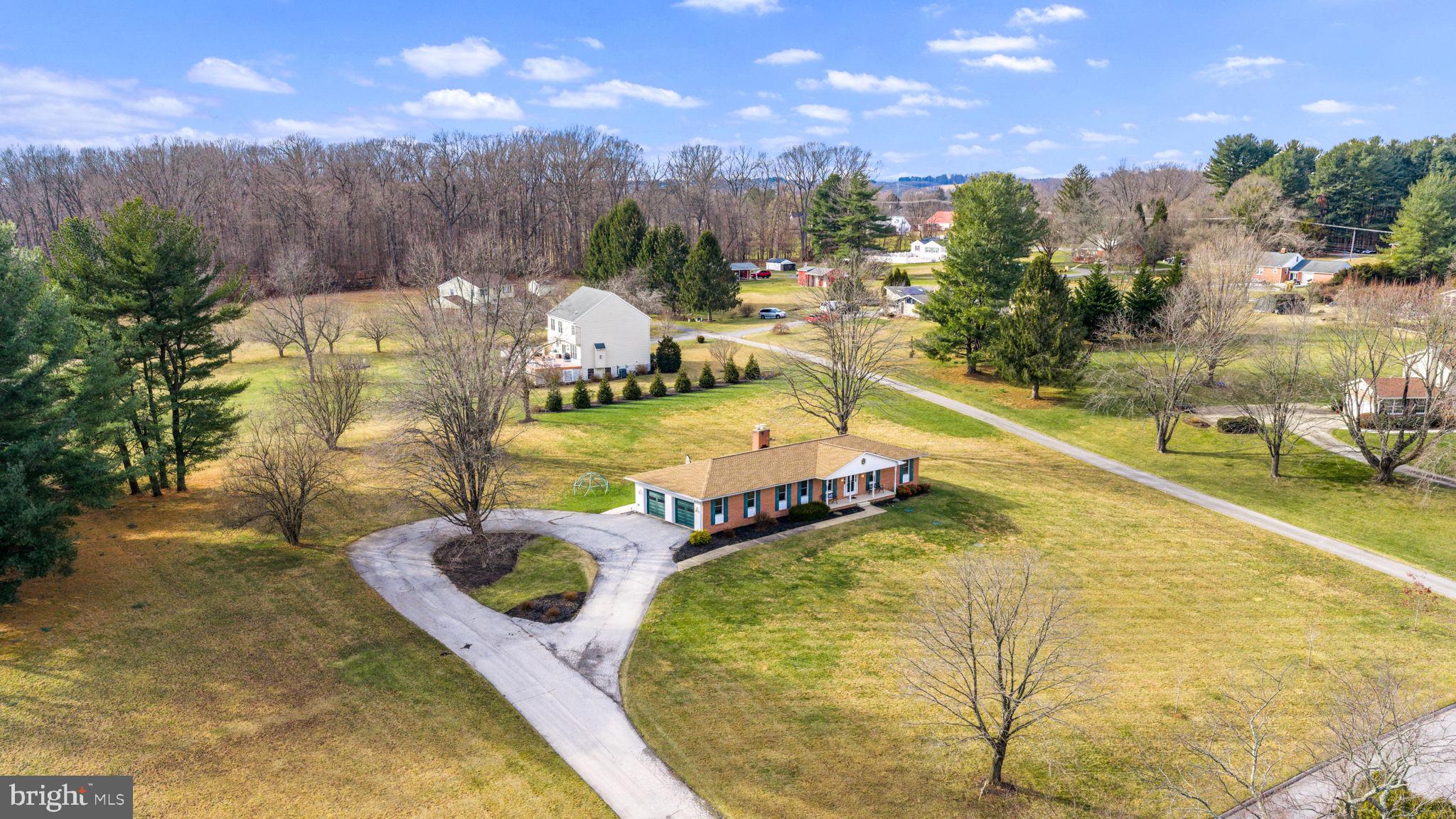16932 Flickerwood Road Parkton, MD 21120 - Photo 52 of 64 a view of a swimming pool with a yard