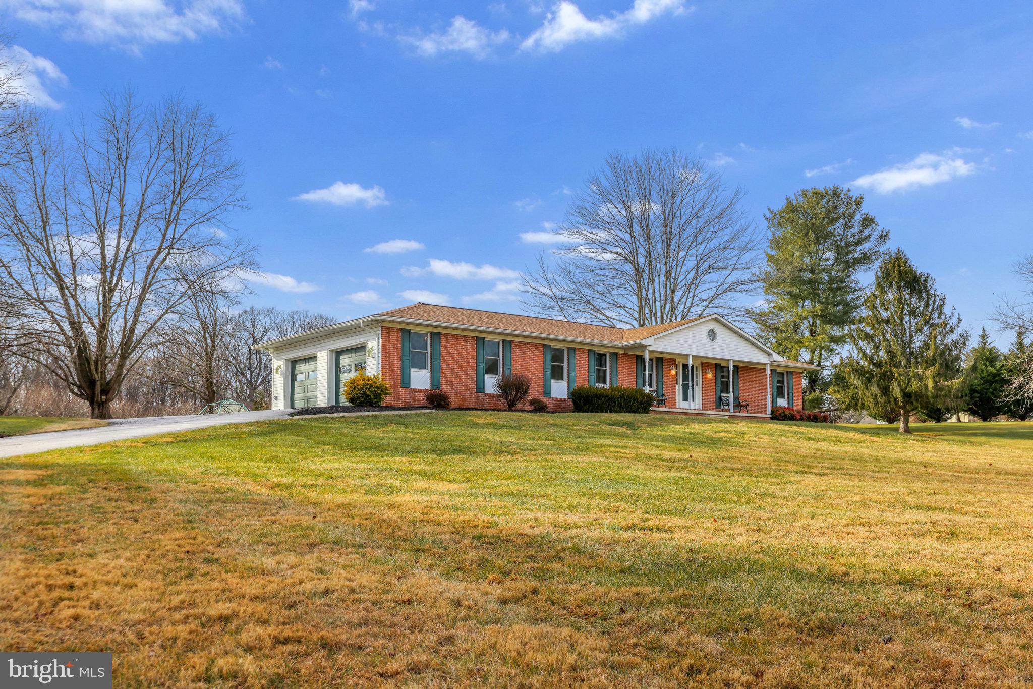 16932 Flickerwood Road Parkton, MD 21120 - Photo 6 of 64 a front view of a house with a yard