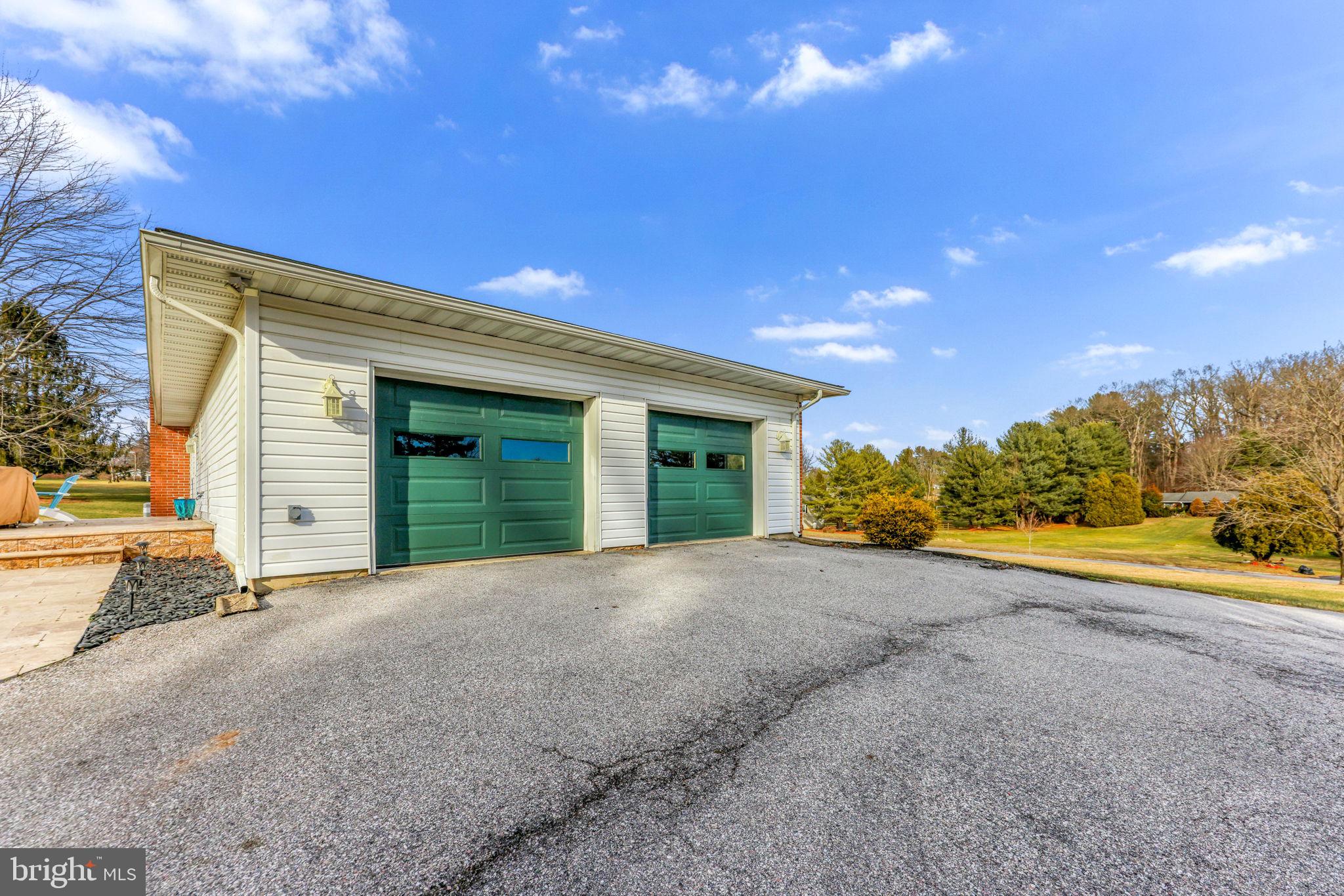 16932 Flickerwood Road Parkton, MD 21120 - Photo 61 of 64 a view of a house with porch and trees