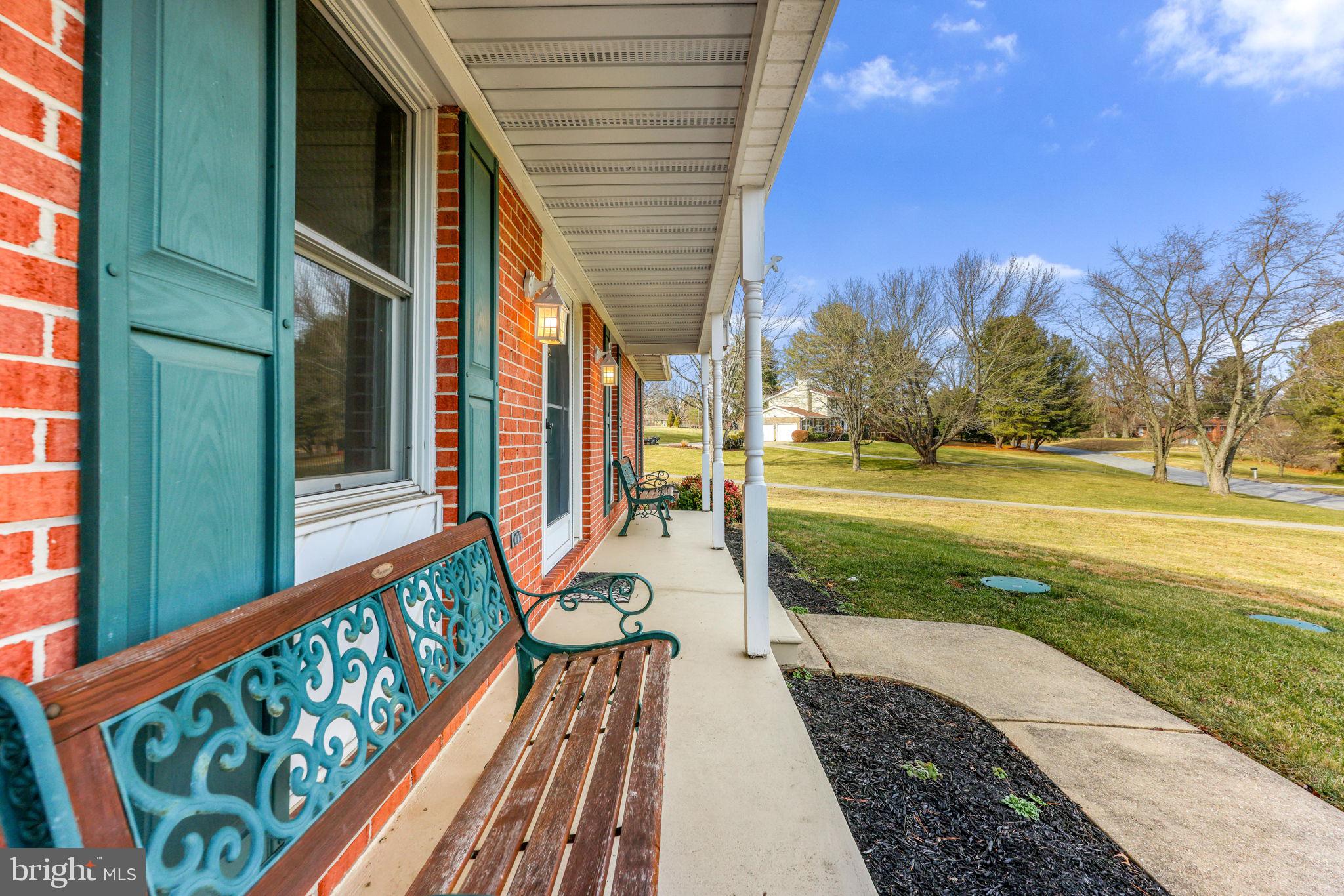 16932 Flickerwood Road Parkton, MD 21120 - Photo 62 of 64 a view of a patio with a table and chairs