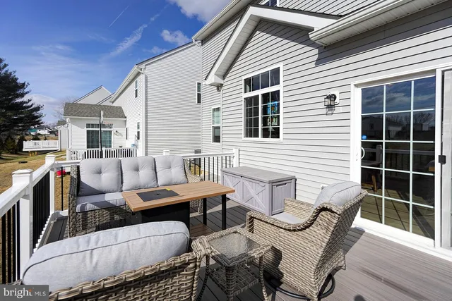 a balcony with furniture and a potted plant