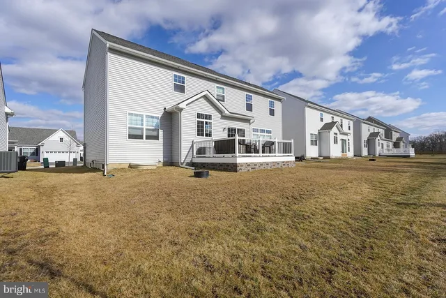 a front view of a house with a ocean view