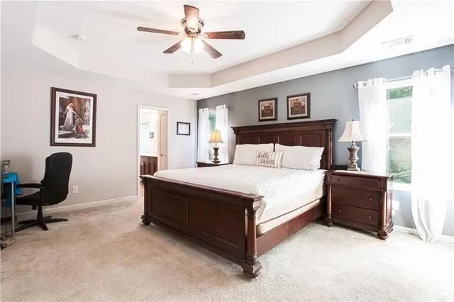 a bedroom with a bed and a desk